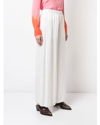 Белые широкие брюки от Raquel Allegra