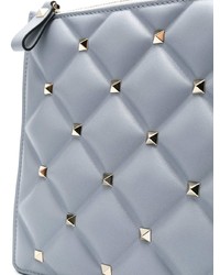 Голубой кожаный клатч с шипами от Valentino