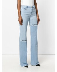 Голубые джинсы-клеш от Philipp Plein