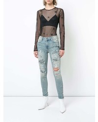 Голубые рваные джинсы скинни от Amiri