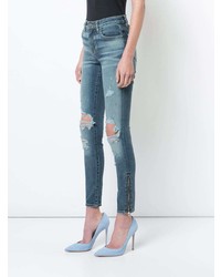 Голубые рваные джинсы скинни от Amiri