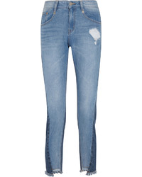 Женские голубые рваные джинсы