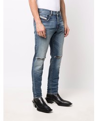 Мужские голубые рваные зауженные джинсы от Diesel