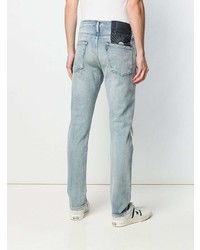 Мужские голубые рваные зауженные джинсы от Levi's