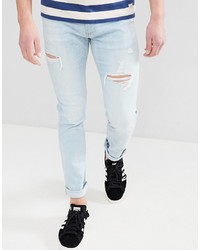 Мужские голубые рваные зауженные джинсы от Hollister