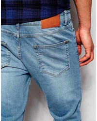 Мужские голубые рваные зауженные джинсы
