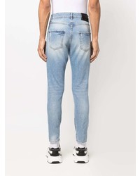 Мужские голубые рваные зауженные джинсы от John Richmond