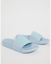 Голубые резиновые сандалии на плоской подошве с принтом от Juicy Couture