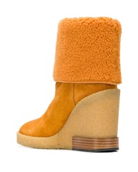 Горчичные замшевые ботильоны на танкетке от Tod's