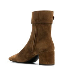 Горчичные замшевые ботильоны от Saint Laurent