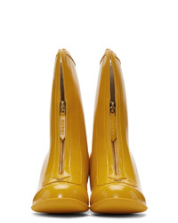 Горчичные кожаные ботильоны от Gucci