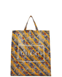 Мужская желтая кожаная большая сумка с цветочным принтом от Gucci