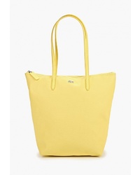 Желтая кожаная большая сумка от Lacoste