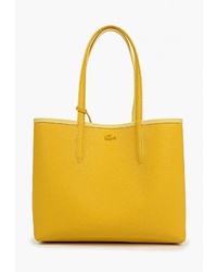 Желтая кожаная большая сумка от Lacoste