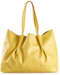 Желтая кожаная большая сумка от Nina Ricci
