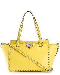 Желтая кожаная большая сумка от Valentino Garavani