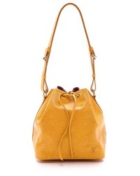 Желтая кожаная сумка-мешок от Louis Vuitton
