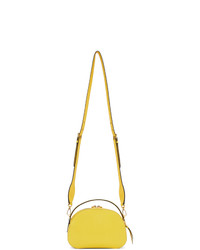 Желтая кожаная сумка через плечо от Prada