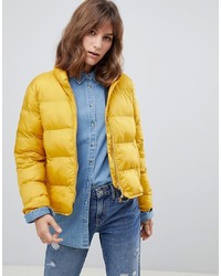 Женская желтая куртка-пуховик от Herschel Supply Co.
