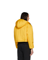 Женская желтая куртка-пуховик от Pyer Moss
