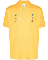 Мужская желтая футболка-поло с вышивкой от Lacoste