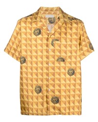 Желтая шелковая рубашка с коротким рукавом с геометрическим рисунком