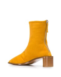 Желтые замшевые ботильоны от Acne Studios