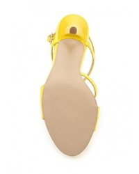 Желтые кожаные босоножки на каблуке от Calipso