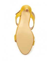 Желтые кожаные босоножки на каблуке от Catisa