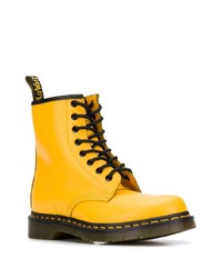 Женские желтые кожаные ботинки на шнуровке от Dr. Martens