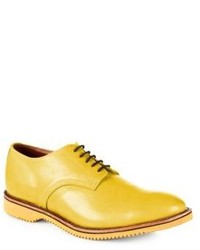 Желтые кожаные туфли дерби