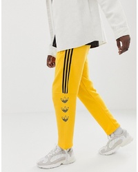 Мужские желтые спортивные штаны с принтом от adidas Originals