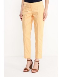 Желтые узкие брюки от Modis