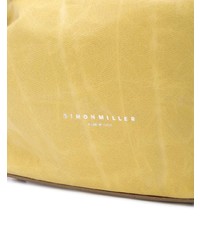 Желтый кожаный клатч от Simon Miller