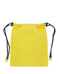 Желтый сатиновый клатч от Off-White