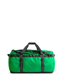 Зеленая дорожная сумка из плотной ткани