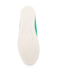 Зеленые кожаные кроссовки на танкетке от Burlesque