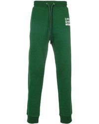 Зеленые спортивные штаны с принтом