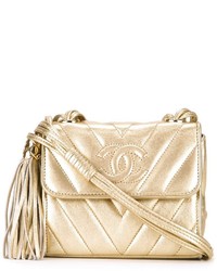 Золотая сумка через плечо в горизонтальную полоску от Chanel