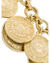 Золотой браслет от Balmain