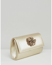 Золотой клатч от Lotus