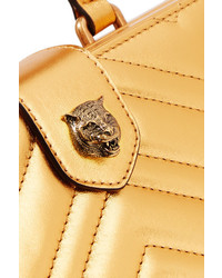Золотой кожаный стеганый клатч от Gucci