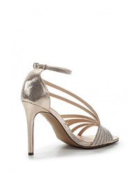 Золотые босоножки на каблуке от Sergio Todzi