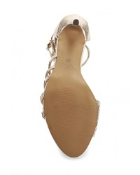 Золотые босоножки на каблуке от Sergio Todzi