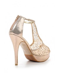 Золотые босоножки на каблуке от Stephan