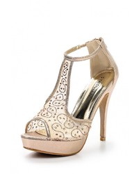 Золотые босоножки на каблуке от Stephan