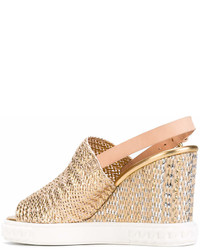 Золотые босоножки на танкетке от Casadei