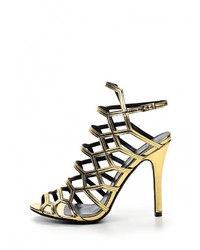 Золотые кожаные босоножки на каблуке от Anne Michelle