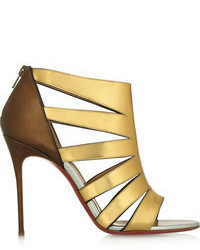Золотые кожаные босоножки на каблуке от Christian Louboutin