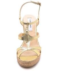 Золотые кожаные босоножки на танкетке от LK Bennett